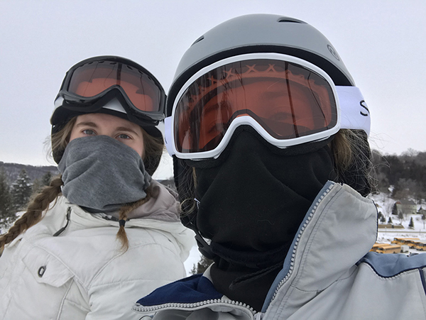 Anna Warmka takes a selfie with a classmate while they ride on a chair lift for their class at Hyland Hills Ski Resort.