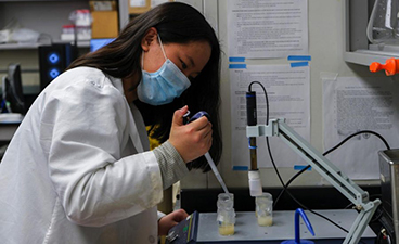 Second-year student Madison Stoltzman works in a lab in the University’s Food Science and Nutrition Building on Monday, March 21. Stoltzman assisted masters students on two research projects studying pea proteins in beverages