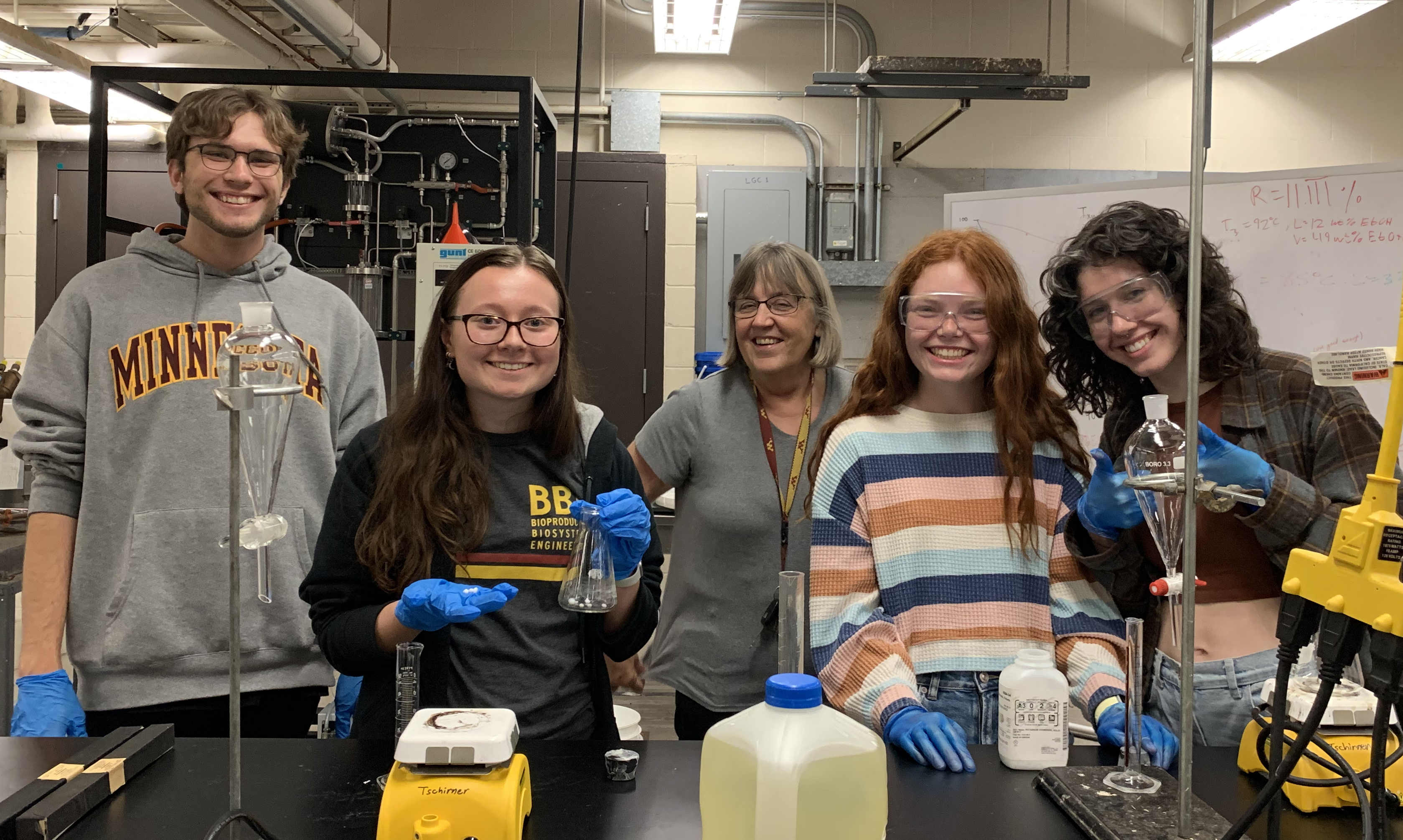 Professor Ulrike Tschirner poses for a photo with a student group in her lab located in Kaufert Lab.