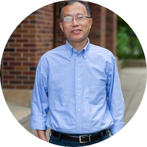 A headshot of Department Head Hua Zhao from the waist up, smiling, and wearing a business casual top. 