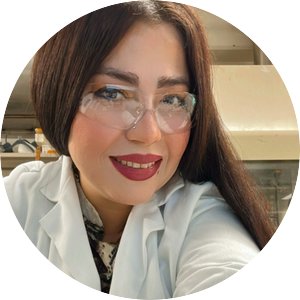 Elmira Kaffashsaei wearing safety goggles and a lab coat