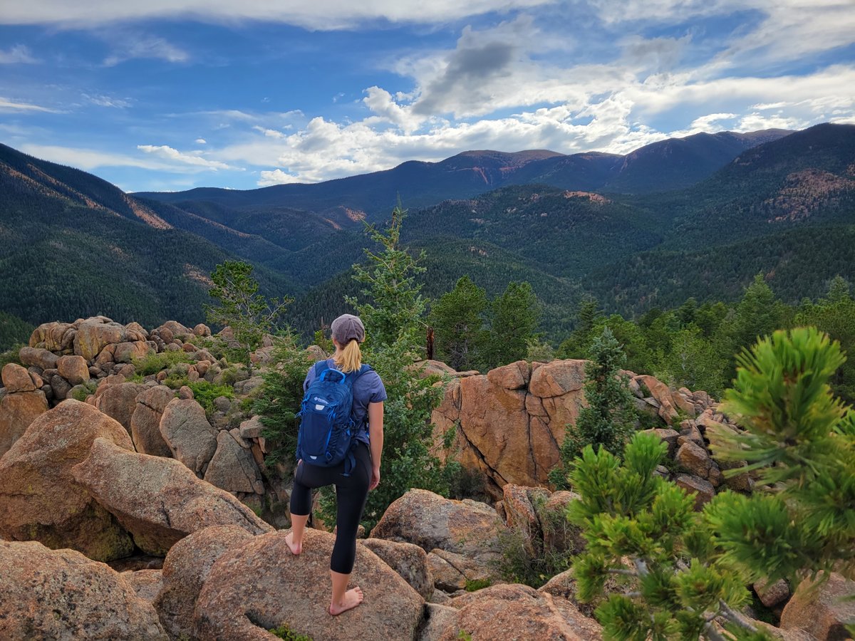 Maddi King looks over the rocky mountains on a hike in Colorado.