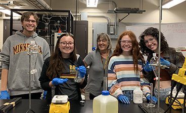 Ulrike Tschirner poses for a quick photo with a student group in her lab located in Kaufert Lab